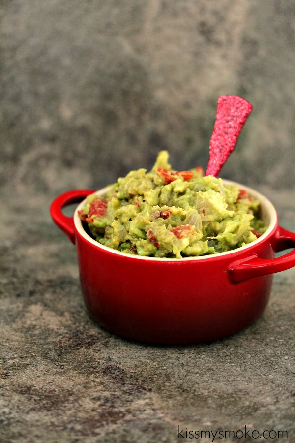 guac cooked on the grill and served in a red dish