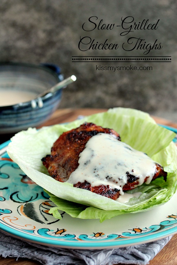 Slow Grilled Chicken Thighs with Alabama White Sauce served on lettuce
