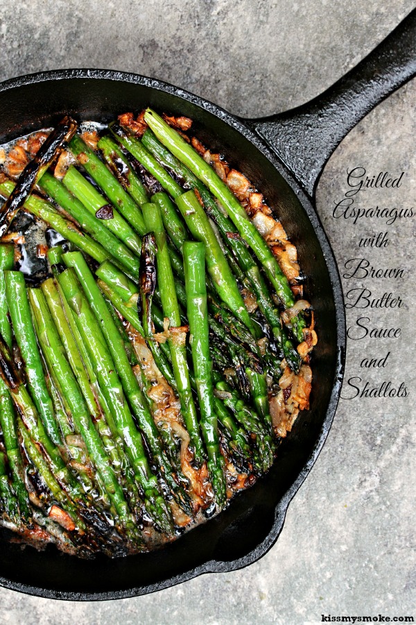 Grilled Asparagus in Brown Butter and Shallots grilled in a cast iron pan and smothered in brown butter and shallots. 