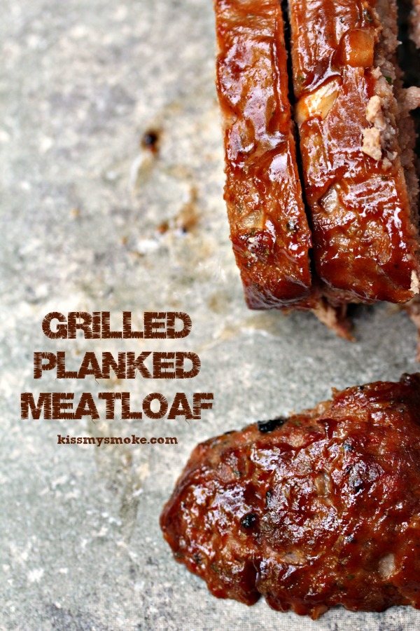Grilled Meatloaf cooked and sliced on a counter.