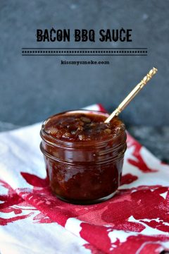 Bacon Barbecue Sauce served in a mason jar with a spoon in it