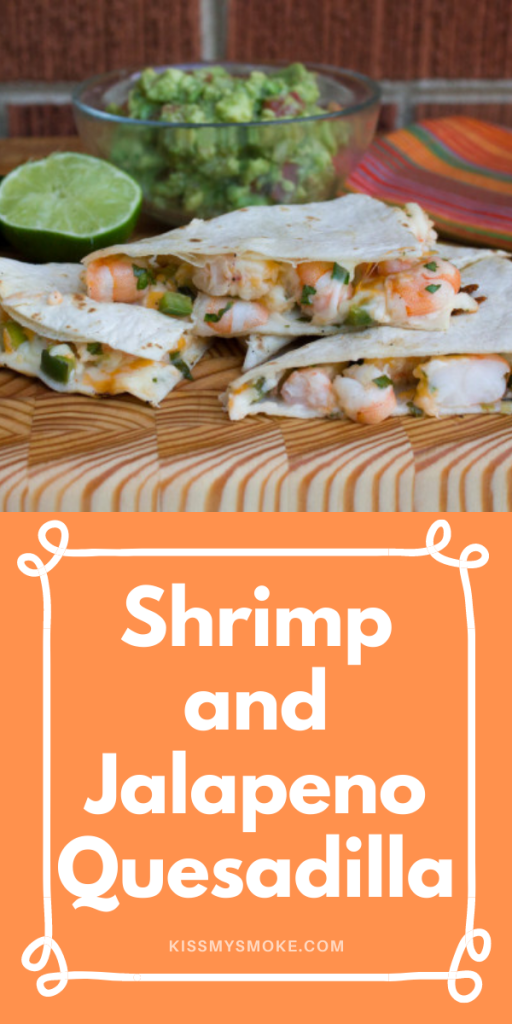 Shrimp and Jalapeno Quesadilla stacked on a wooden board.