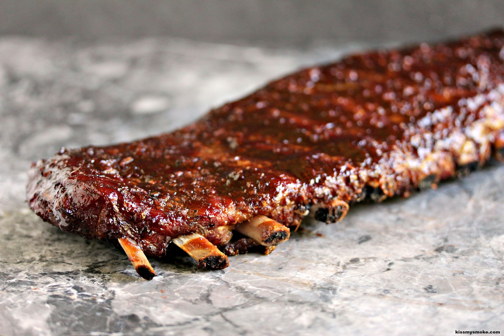 Smoked Ribs- These smoked ribs are cooked to perfection using the 3, 2, 1 method. You are going to love this recipe by kissmysmoke.com ! #sponsored #CelebrateCanada @WeberGrillsCA