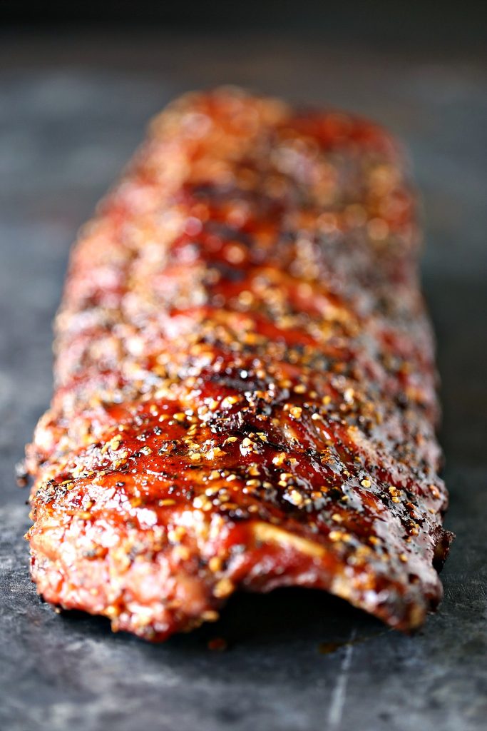 Easy Grilled Honey-Garlic Ribs from kissmysmoke.com- This is a simple, no-fuss recipe for honey garlic ribs that will make your taste buds do the happy dance. You can easily customize this to your own taste and heat preferences. Make this recipe today!