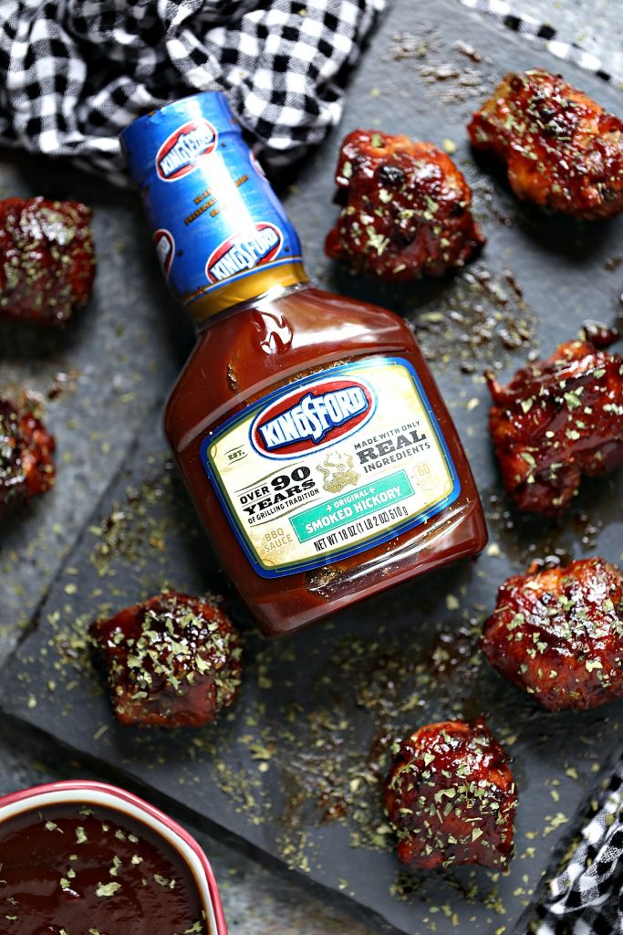 Cheesy BBQ Sausage Bites wrapped in bacon and slathered in Kingsford sauce. 