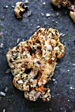 overhead image of grilled spicy cauliflower steaks