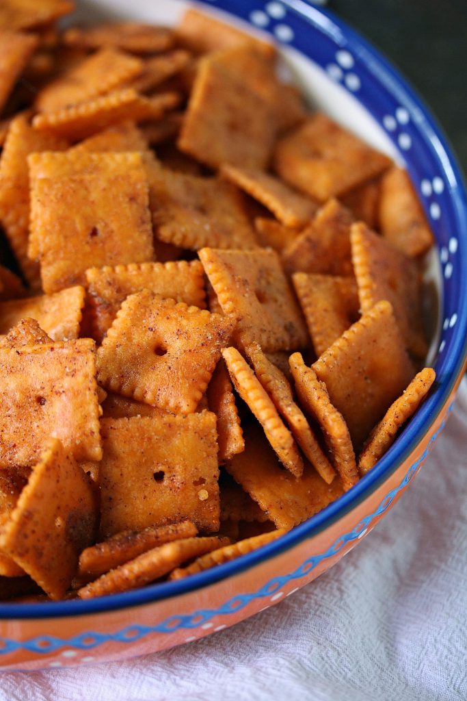Smoked Cheez Its in a brightly coloured bowl. 